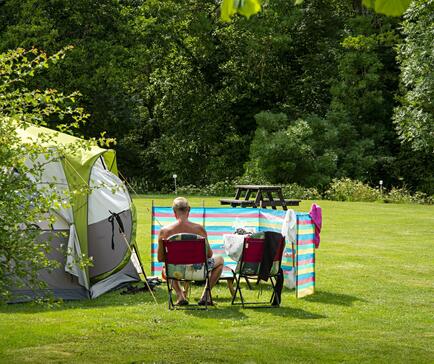 Relaxing grass camping field at Rockbridge Park, Wales