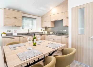 Holiday home buyers guide. Static caravan kitchen dining area photo