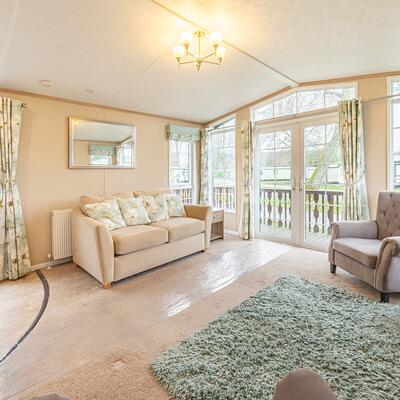 Pre-owned Pemberton Serena static caravan for sale 5 star caravan holiday park. Lounge photo