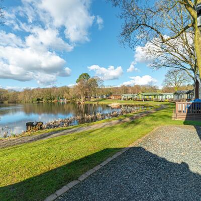 Regal Cranleigh Lodge holiday home for sale at Pearl Lake Country Holiday Park. Lake edge plot photo