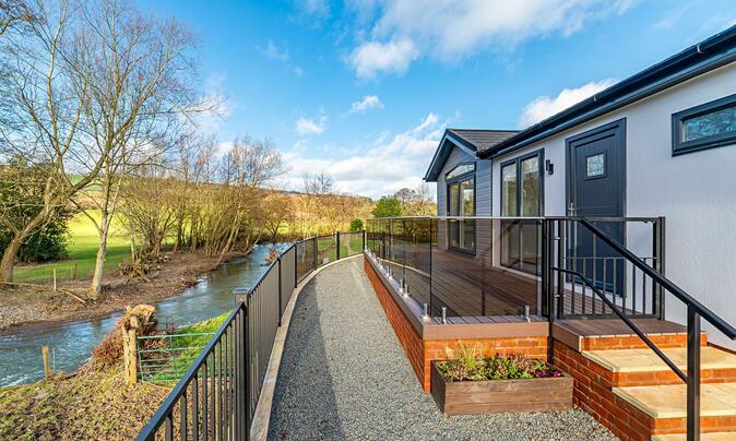 Luxury Cosgrove Lodge residential park home for sale in Wales. Exterior photo