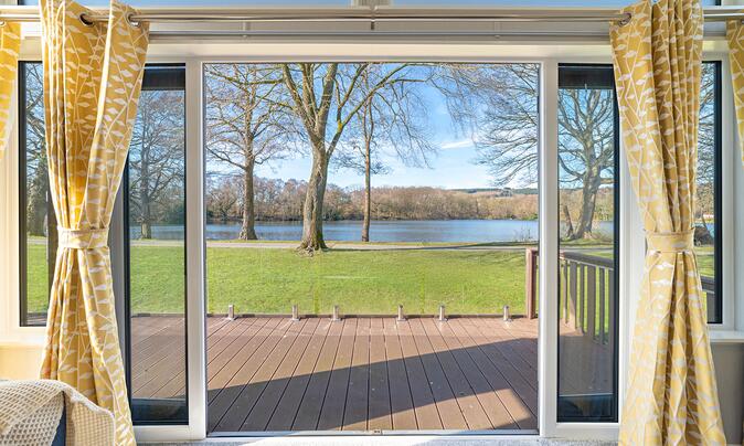 Willerby Vogue Nouveau for sale on lake edge pitch at 5 star caravan holiday park. Pitch view photo