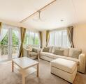 Regal Autograph holiday home for sale on 5 star caravan park with bar restaurant. Lounge photo