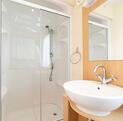 Regal Autograph holiday home for sale on 5 star caravan park with bar restaurant. Main shower room photo