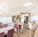 Atlas Ovation Lodge caravan holiday home for sale on 5 star caravan park with fishing - kitchen dining area photo