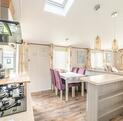 Atlas Ovation Lodge caravan holiday home for sale on 5 star caravan park with fishing - kitchen dining area photo