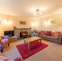 Self-actering holiday cottage with golf course - lounge photo