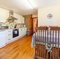 Pet friendly holiday cottage with fishing and golf course - kitchen dining area photo