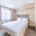 Regal Harlington caravan holiday home for sale on 5 star static caravan holiday park. Main bedroom photo